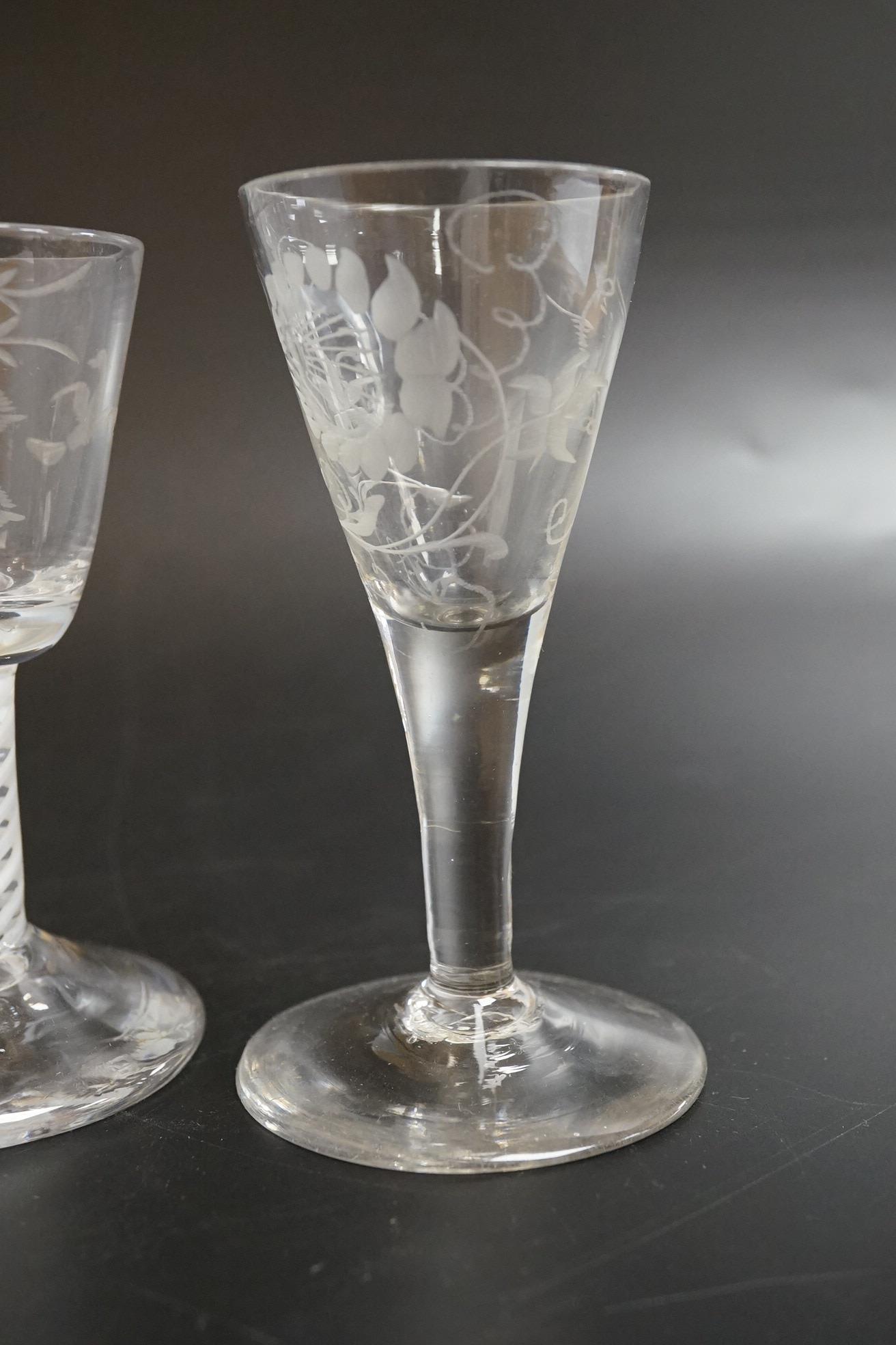 Two George III firing glasses, one with DSOT stem, together with a gin glass with engraved bowl, tallest 11.5cm high (3)